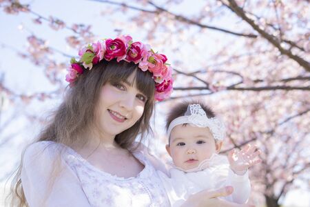 Baby, Mother and Cherry Treeの写真素材