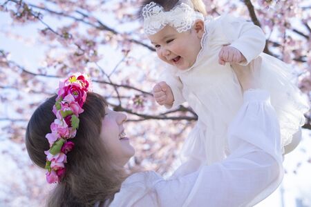Baby, Mother and Cherry Treeの写真素材
