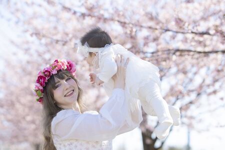 Baby, Mother and Cherry Treeの写真素材