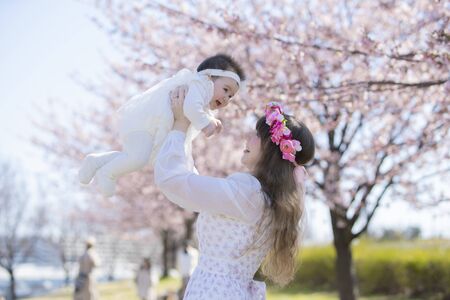 Baby, Mother and Cherry Treeの写真素材