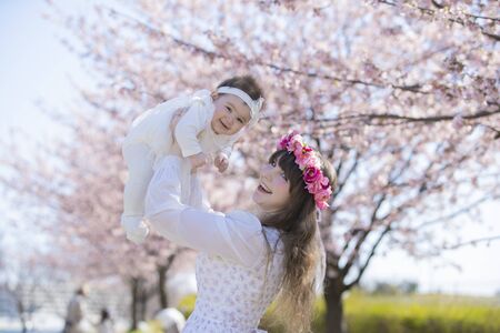 Baby, Mother and Cherry Treeの写真素材