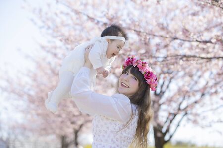 Baby, Mother and Cherry Treeの写真素材