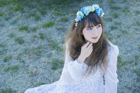 a woman in a blue flower crownの写真素材