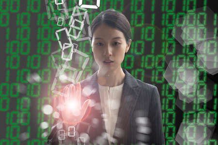 Composite photo of a woman seeking the right answer in a digital virtual spaceの写真素材