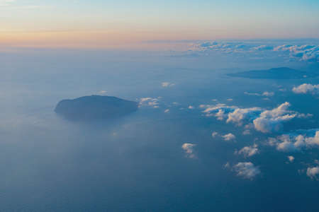 View of the sea and clouds seen from a passenger plane