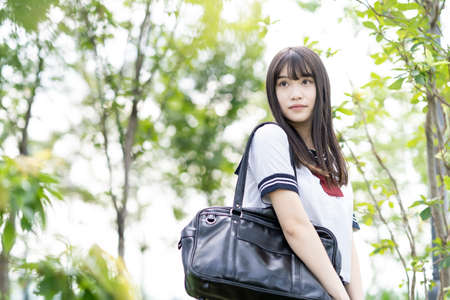 female asian high school student with a calm look outdoorsの写真素材