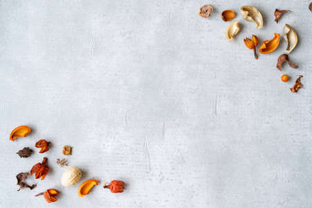 Copy space made of dried flowers on concrete boardの写真素材