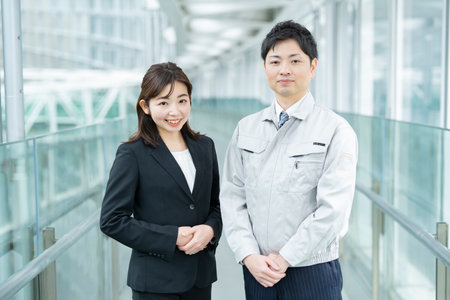 A businessman in work clothes and a business woman in a suitの写真素材