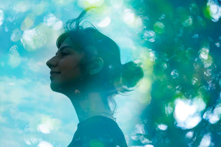 Ecology image-Synthetic CG the profile of a woman and out-of-focus forestの写真素材