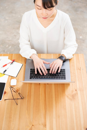 Asian young woman working in a casual space