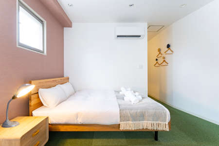 Bright bedroom with white sheets in the room