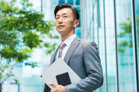 Asian businessman with a serious lookの写真素材