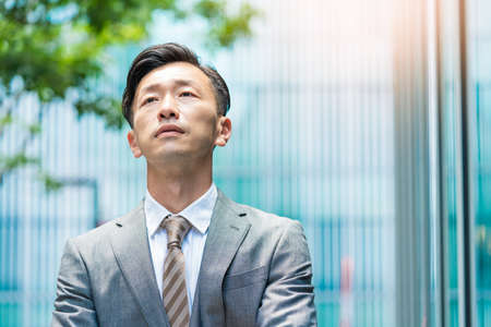 Asian businessman with a stressed lookの写真素材