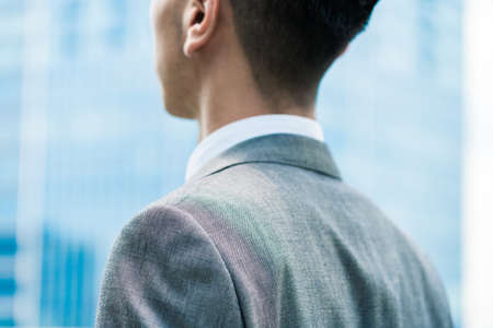 Anonymous image of a businessman standing outdoorsの写真素材