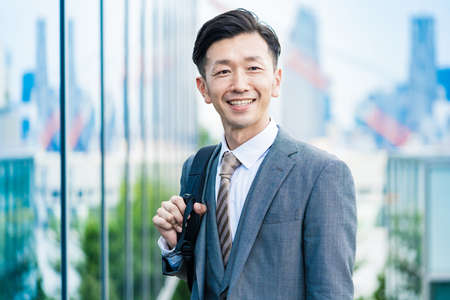 Asian businessman who commute with a smile