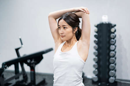 Asian young woman training in the gymの写真素材