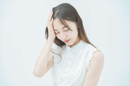 Asian young woman with a stressed look