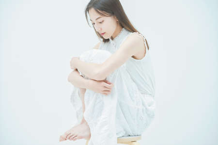 Asian young woman with a stressed lookの写真素材