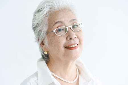 Portrait of asian white-haired aged womanの写真素材