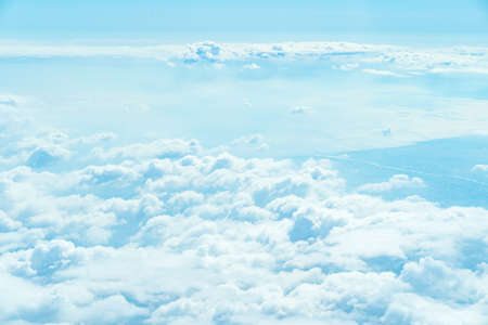 Overlooking the clouds from the window of the plane