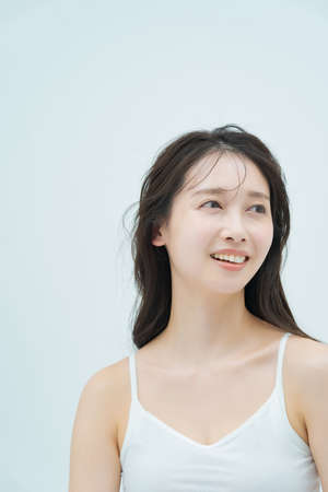 Asian black-haired woman with a moist atmosphereの写真素材