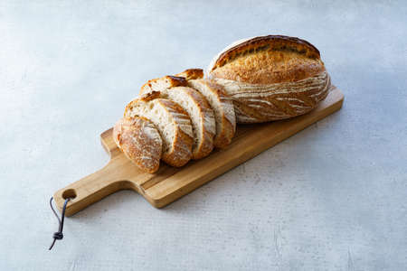 Breads that has been cut and placed on a cutting board