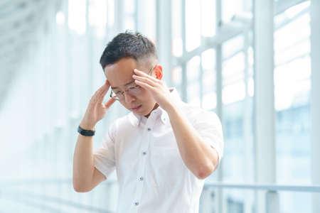 A young businessman with a stressed lookの写真素材