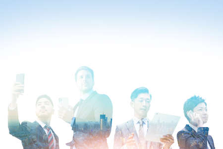 Synthetic CG of a business person with communication equipment and a cityの写真素材