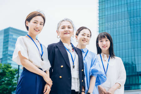 Business women of various generations outdoorsの写真素材
