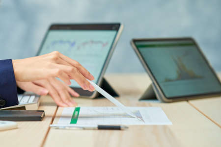Business woman giving a presentation using reference materials