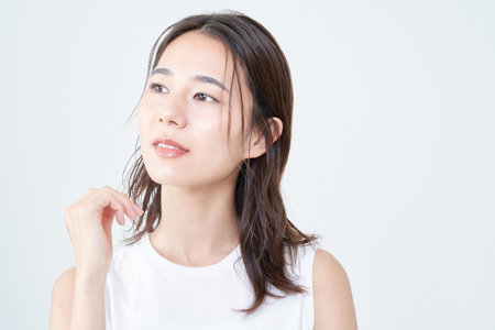 portrait of asian young woman and white backgroundの写真素材