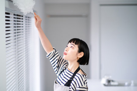 asian young woman cleaning the room
