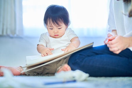 young mother and child playing with drawingの写真素材