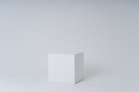 A white box in a white roomの写真素材