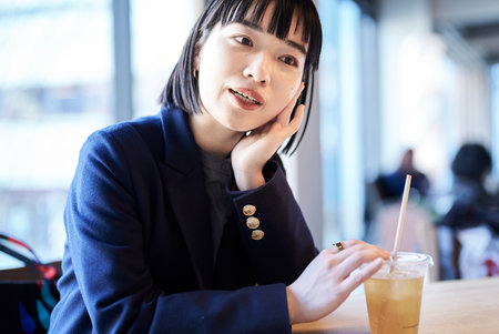 A young woman relaxing in a cafeの写真素材