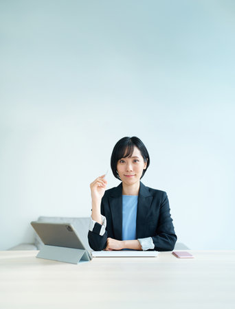 Portrait of a business woman working at officeの写真素材