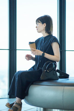 portrait of a young woman by the windowの写真素材