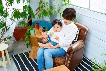 Mother and child relaxing indoors