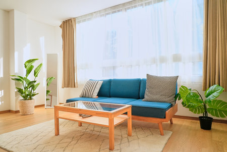 Bright interior with a blue sofaの写真素材