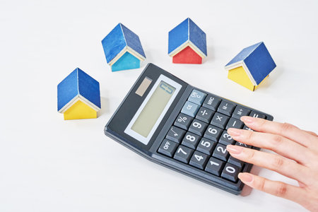 Colorful house models and calculator on the talbeの写真素材