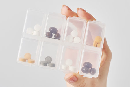 Tablets in individually separated plastic cases and white backgroundの写真素材