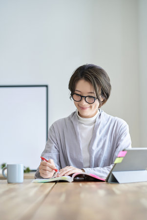 Middle-aged woman working in a room