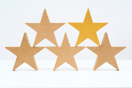 Five star wooden blocks arranged and White background