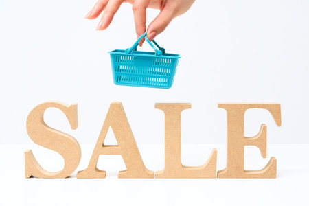 Wooden alphabet blocks with the word "SALE" and White backgroundの写真素材