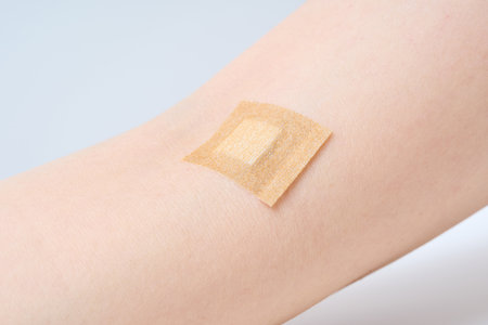 A patched arm after receiving an injection at the hospital