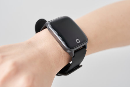 smart watch on a woman's wrist and white backgroundの写真素材