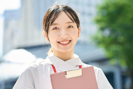 Portrait of a young nurse outdoorsの写真素材