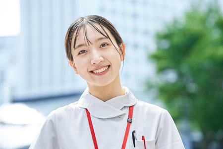Portrait of a young nurse outdoorsの写真素材