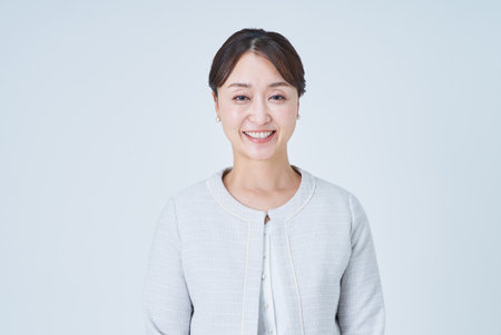 Asian middle businesswoman portrait and white backgroundの写真素材