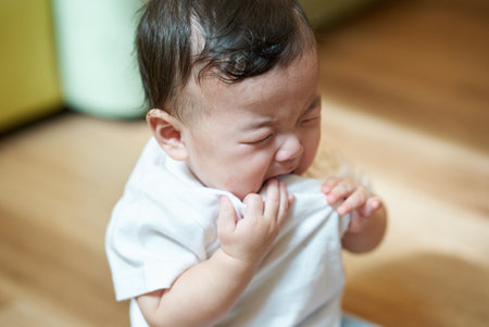 A baby crying in the living room